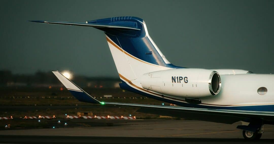 Close-up of a private jet on the tarmac at dusk