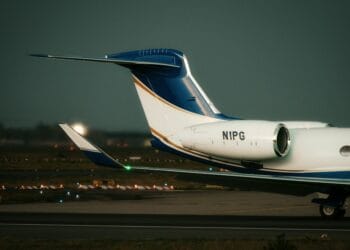 Close-up of a private jet on the tarmac at dusk